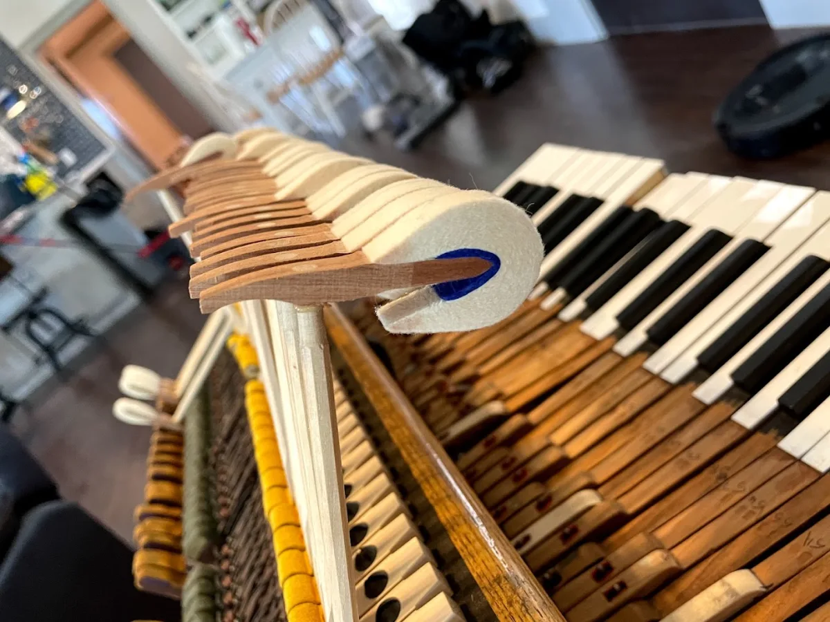 Close-up of piano hammer felt and shank